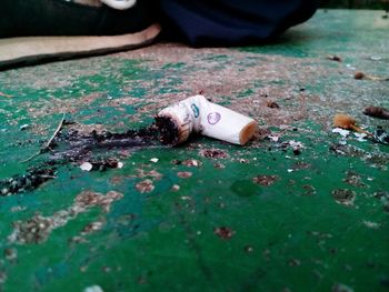 Cigarette butt on footpath