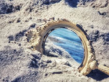 High angle view of beach seen through arch