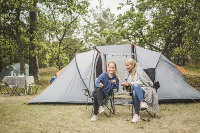 People sitting in tent