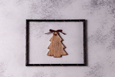Close-up of christmas decoration hanging on wall