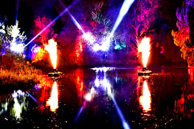 Illuminated fountain at night