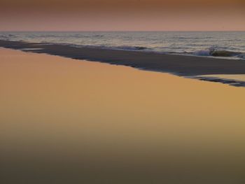 Scenic view of beach against clear sky