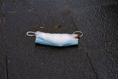 High angle view of umbrella on wet street