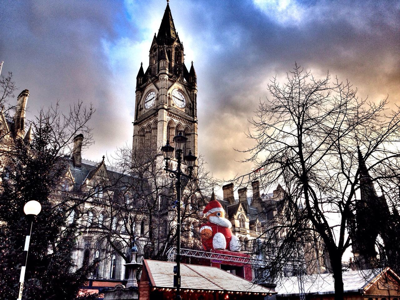 building exterior, architecture, built structure, religion, church, place of worship, low angle view, sky, spirituality, cathedral, tower, tree, cloud - sky, bare tree, city, branch, clock tower, famous place