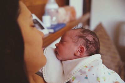 Close-up of mother with baby boy