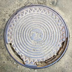 High angle view of manhole on street