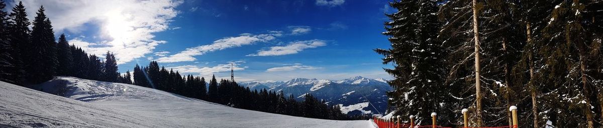 Panoramic view of snowcapped mountains against sky