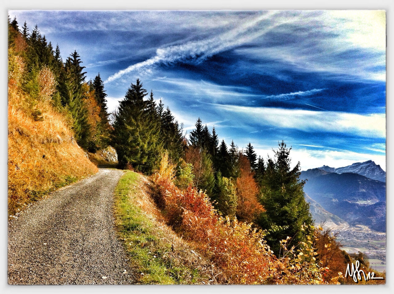 transfer print, mountain, tranquil scene, tranquility, the way forward, sky, tree, scenics, landscape, auto post production filter, beauty in nature, nature, road, mountain range, diminishing perspective, non-urban scene, cloud - sky, growth, cloud, dirt road