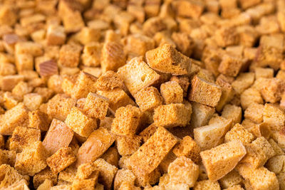 Square-shaped bread crumbs. oven-fried golden brown bread crumbs.