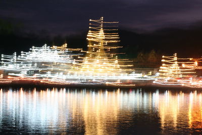 Reflection of illuminated buildings in water at night