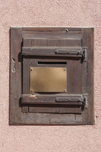 Close-up of mailbox on wall