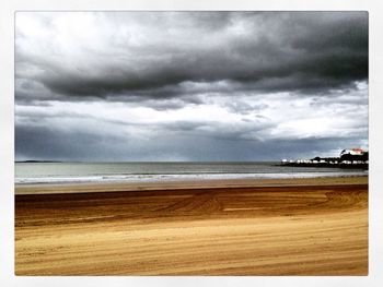 Scenic view of sea against cloudy sky