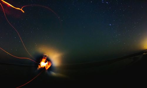 Low angle view of illuminated stars in sky