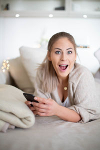 Portrait of young woman at home