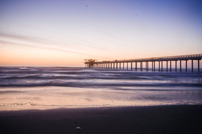 View of suspension bridge at beach