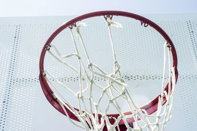 Close-up of basketball hoop against sky