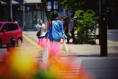 Blurred motion of person walking on road