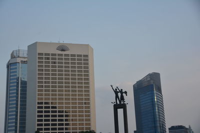 Low angle view of buildings against clear sky