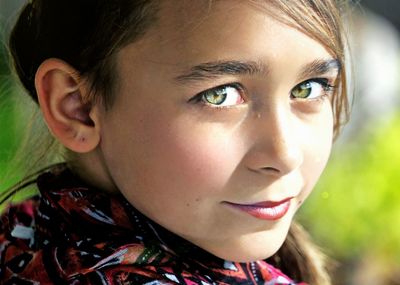 Close-up portrait of girl with green eyes