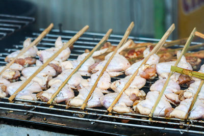 High angle view of meat on barbecue grill