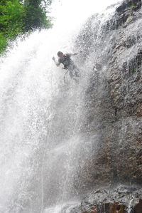 Man surfing in water