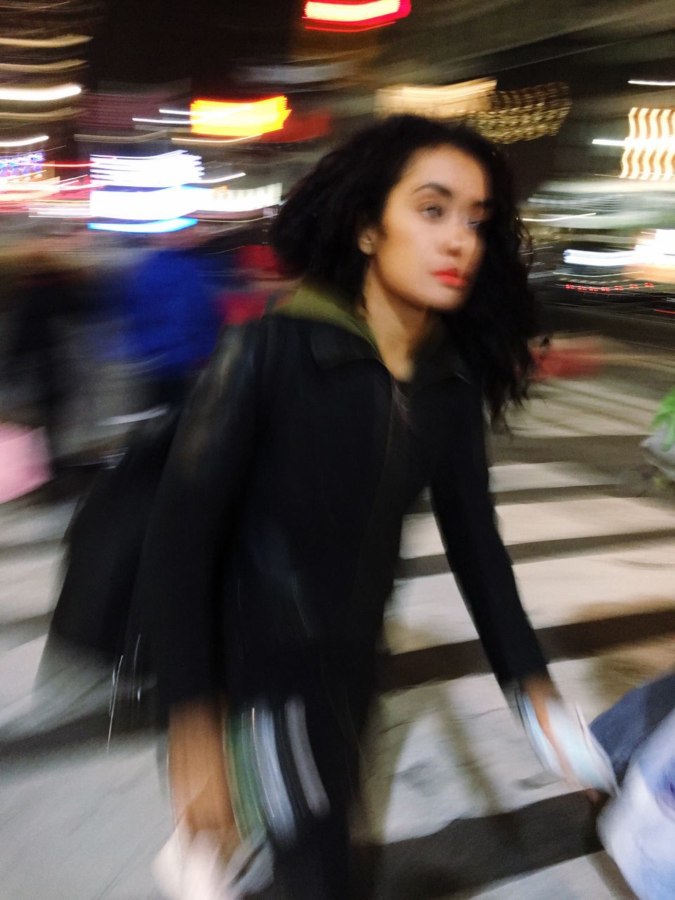 transportation, blurred motion, real people, lifestyles, one person, portrait, looking at camera, mode of transport, leisure activity, city, beautiful woman, young women, indoors, illuminated, smiling, young adult, night, people, adult