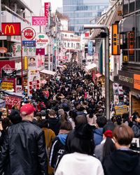 Group of people walking on city street