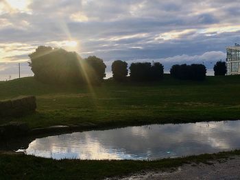 Scenic view of farm against sky