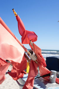 Low section of woman holding umbrella