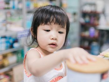 Close-up of cute girl in supermarket