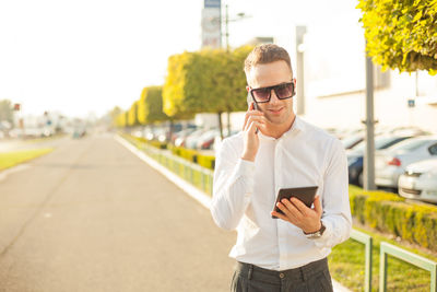 Portrait of young man using mobile phone