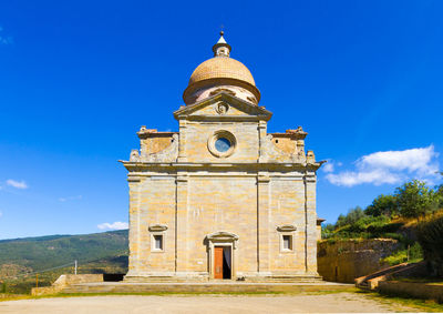 Low angle view of historical building against blue sky