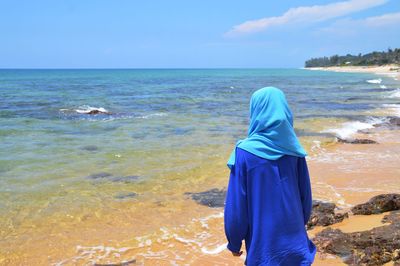 Wearing hijab girl at the beach