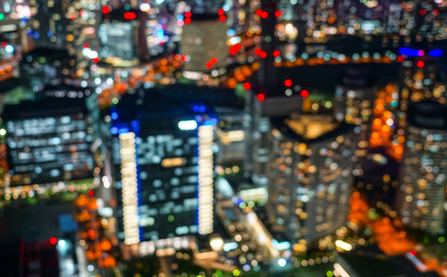 High angle view of illuminated buildings in city at night