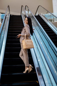 Low angle view of woman on staircase