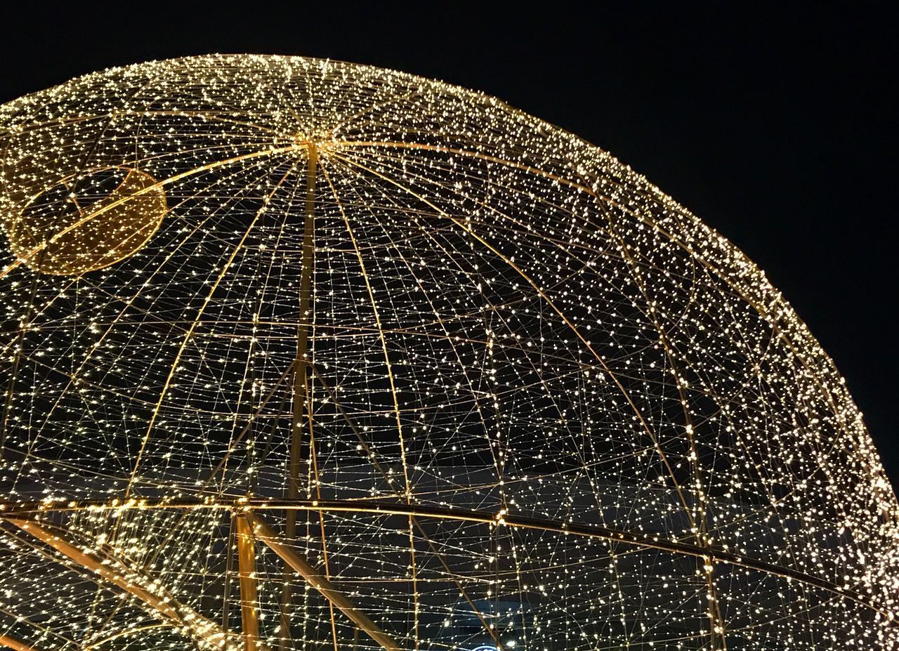 LOW ANGLE VIEW OF ILLUMINATED LIGHTING EQUIPMENT AGAINST SKY