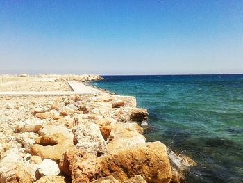 Scenic view of sea against clear blue sky