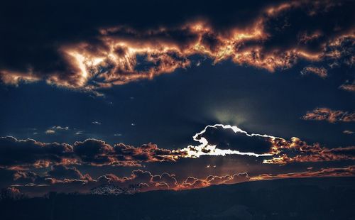 Low angle view of lightning against dramatic sky