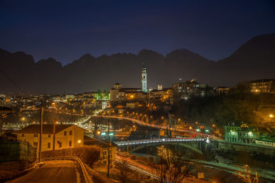 High angle view of illuminated buildings in city at night