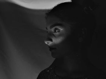 Portrait of young woman looking away