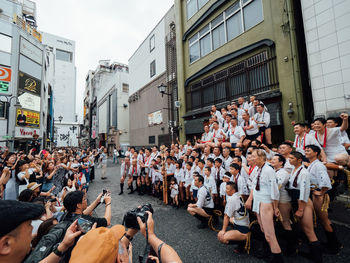 Group of people on street in city