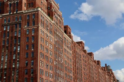 Low angle view of building against cloudy sky