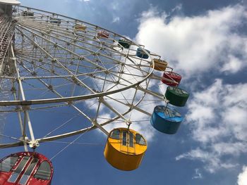 Low angle view of ferris wheel against sky