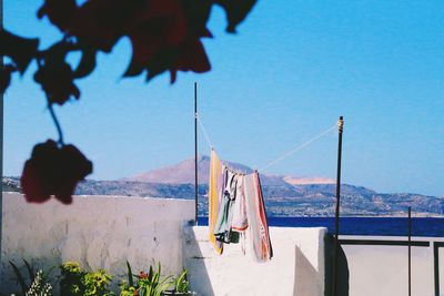 Clothes drying on clothesline against sky