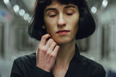 Close-up of young woman with closed eyes