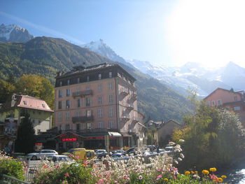 Panoramic view of buildings and mountains against sky