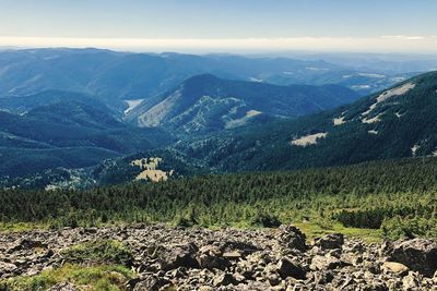 Scenic view of landscape and mountains against sky