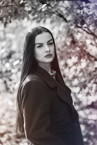 Portrait of a young woman in the park in black and white