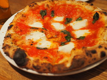 Close-up of pizza served on table