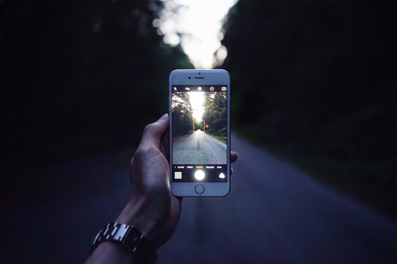 YOUNG WOMAN TAKING SELFIE